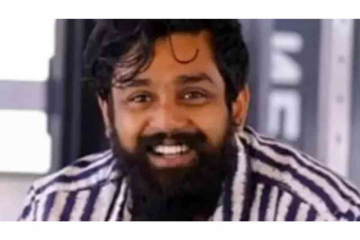 Dhruva Sarja kneels down before fans at the pre-release event of his next movie 'Martin'